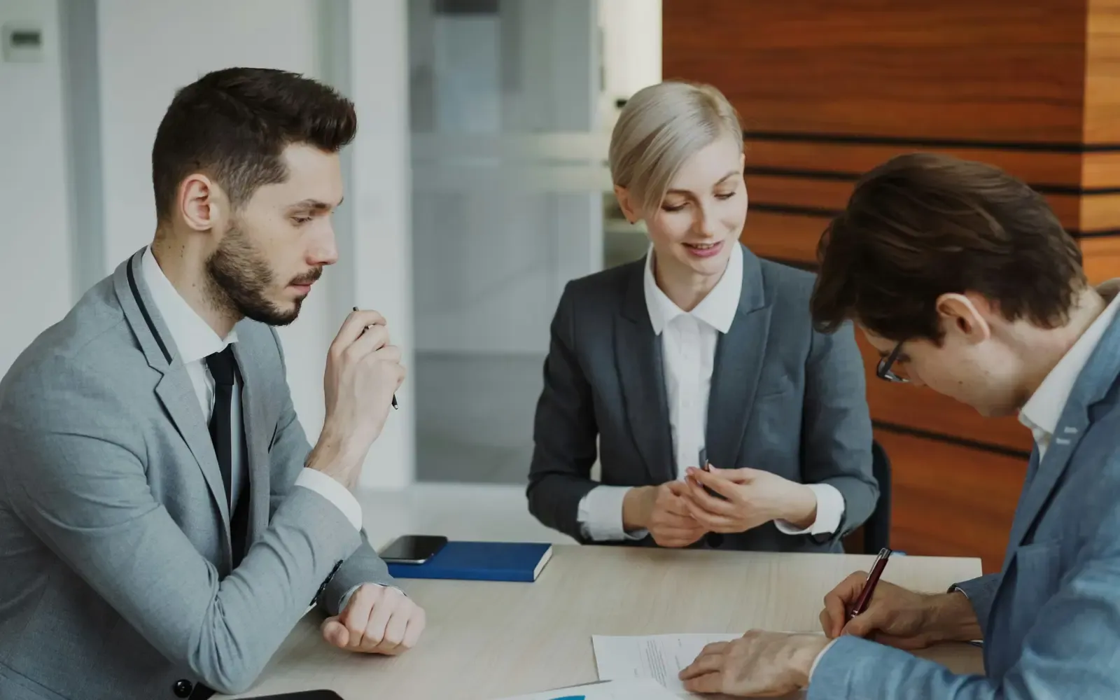 Business client signing a contract after choosing a B2B service provider
